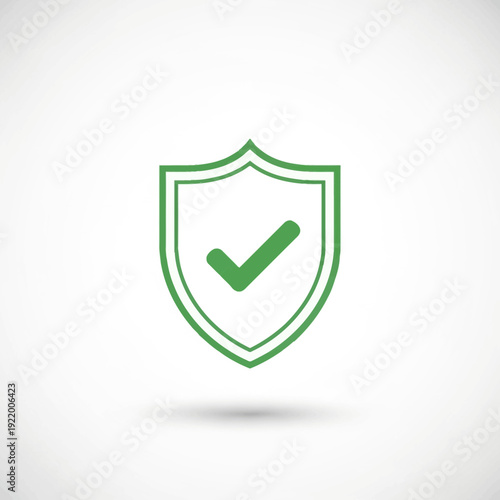 A modern vector illustration of a bold green shield icon featuring a prominent checkmark, symbolizing verified protection, online safety, and security measures in digital environments