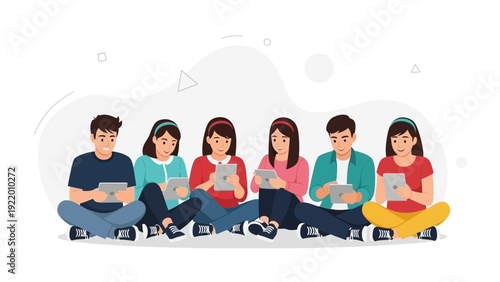 Diverse group of young people sitting together using tablets and smartphones
