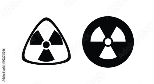 Two radioactive warning symbols in black a striking silhouette