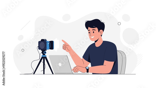 Young man vlogging with camera and laptop, creating online content