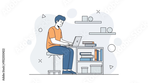 Young Man Working on Laptop at Desk in Modern Home Office