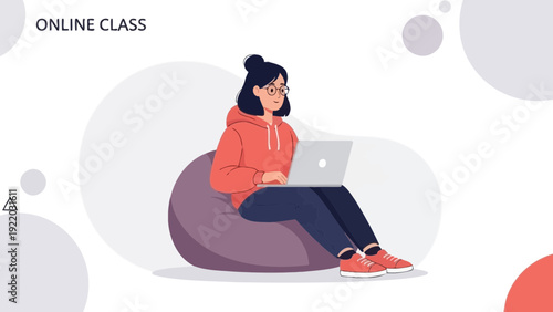 Young Woman Studying Online Class on Laptop, Sitting on Bean Bag Chair
