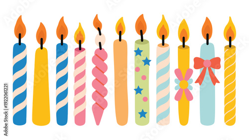 A row of colorful birthday candles with various designs and decorations are lined up on a plain surface.