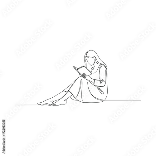 Woman sitting comfortably reading a book in a peaceful setting