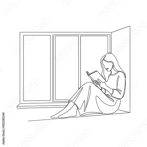 Woman sitting by window reading a book feeling relaxed and peaceful