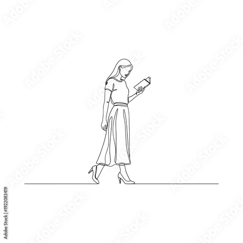 Elegant woman walking while reading document