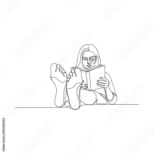 Woman relaxing while reading a book in a peaceful setting