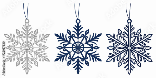 Three different snowflakes hanging on a white background