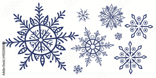 A collection of intricately designed snowflakes in various sizes and patterns