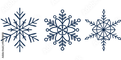 Three distinct snowflakes showcasing the unique beauty of winter's frozen artistry