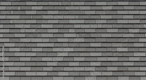 Close-up seamless texture of layered grey asphalt roofing shingles. Ideal uniform abstract background for construction and home repair concepts, gray, silver, structure