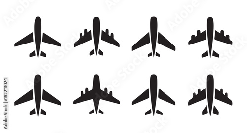 Eight stylized black airplane silhouettes, clean vector graphics for aviation themes