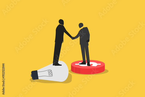Two businessmen shaking hands while standing on a lightbulb and a dollar coin, representing a successful deal between innovation and capital