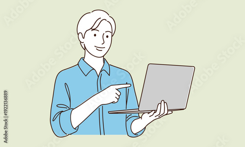 Young man using laptop computer while pointing at screen, modern technology concept showing online learning, remote work, digital communication, productivity, and professional lifestyle in minimalist