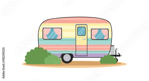 Retro camper trailer with vibrant rainbow stripes parked outdoors near green bushes for a fun summer camping trip.