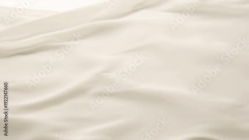 Monochromatic Fabric Blur A single piece of fabric in a neutral tone, moving to create soft, blurred lines and shapes with long exposure.