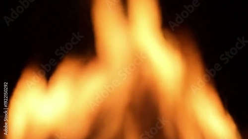 Firelight on Smoke Extreme close-up of delicate tendrils of smoke rising from a dying flame, illuminated by soft backlight, creating beautiful, swirling patterns against a clean, dark background.