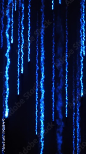 Blue Vertical Light Streaks on Dark Background.