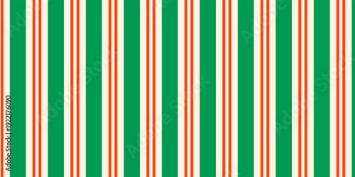 Christmas seamless pattern. Red and green diagonal stripes background. Candy cane repeating decoration wallpaper. Winter holiday lines backdrop. vector