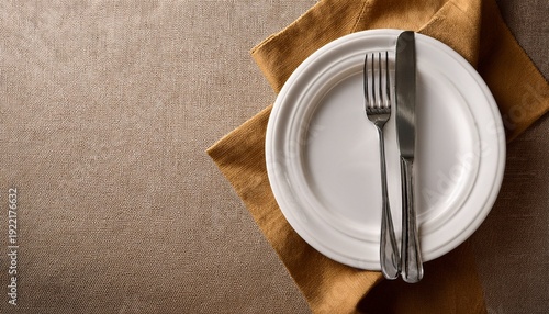 Plate Knife And Fork On Napkin Cloth