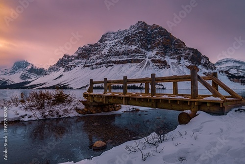 Sunrise Over Mountains And Footbridge At Bow Lake