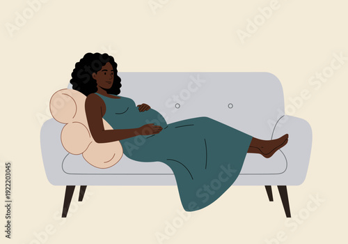 Pregnant Woman Relaxing on Sofa in Dress.