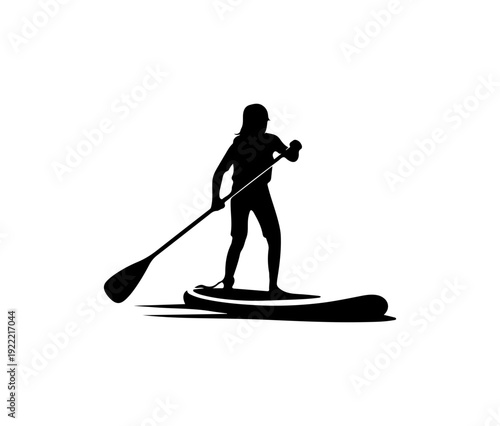 Woman paddleboarding on calm water with long paddle