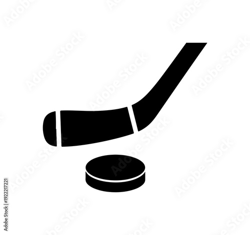 Hockey puck and stick in dynamic motion on ice rink