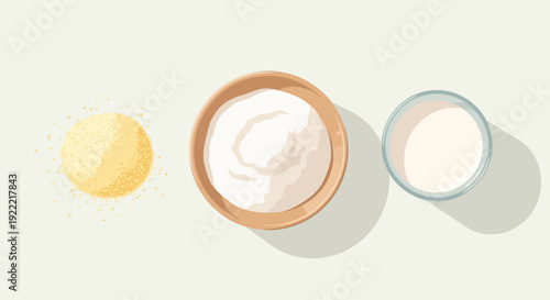 Overhead view of butter yogurt and milk on a white surface.