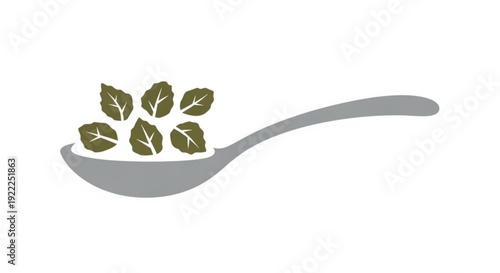 Fresh green leaves on a gray spoon against a white background symbolizing healthy eating and nutrition