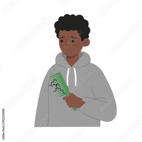 Hairloss concern young man holding green comb with hair strands sad expression wearing gray hoodie