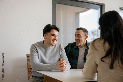 Happy family men consulting with financial advisor