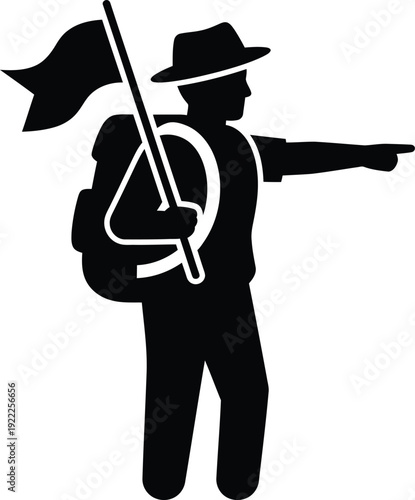 A silhouette of a man in a hat pointing with a flag and backpack