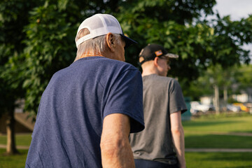 Grandpa and Grandson walking through public square