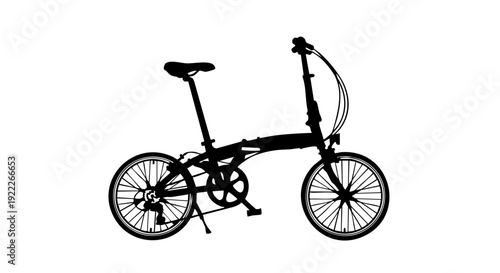 Silhouette of a folding bicycle against a plain backdrop. The bike is designed for easy storage and portability