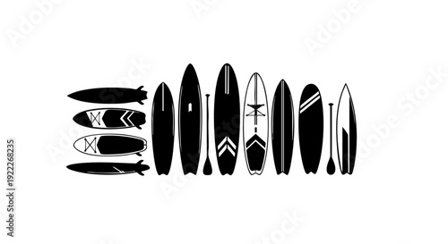 Row of black and white stand-up paddleboards with paddles. A perfect illustration for watersport enthusiasts 