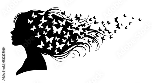 Silhouette of a Womans Head with Butterflies Emerging from Hair.
