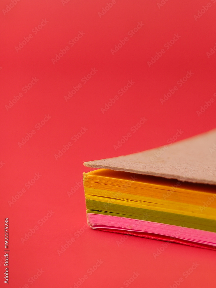 Fototapeta premium Closeup of a neon-colored sticky notes, often used for reminders and organization