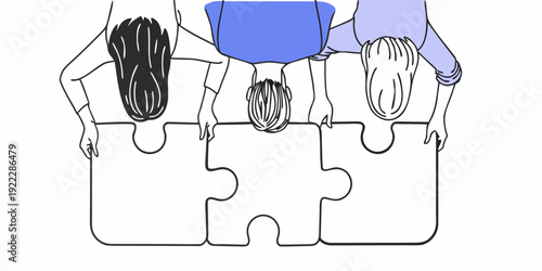 Diverse group of people holding up puzzle pieces symbolizing unity