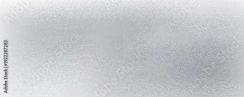 Glowing brushed silver foil metallic wall, abstract texture background
