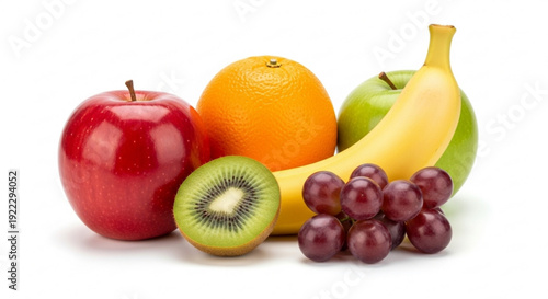 Fresh fruit assortment with apple orange banana kiwi and grapes on white background for healthy eating concepts