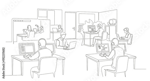 People working in an office environment with computers.