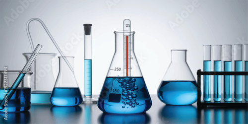 Laboratory glassware equipment with blue liquids on a table in a science lab setting