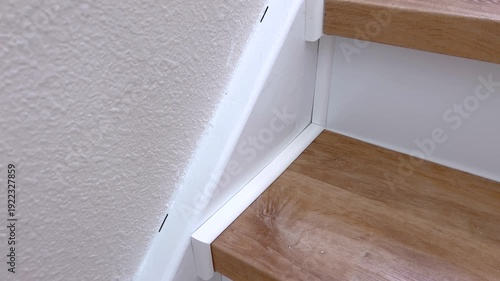 Close up of stair tread and wall seam