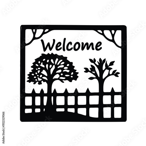 Black and white welcome sign with trees and a picket fence