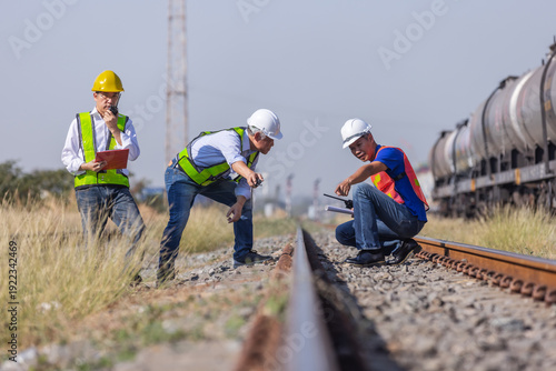 Railway Engineering Team Inspecting Rail Track at Freight Yard