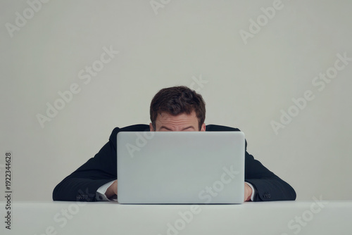business man use laptop on a table and white background stressed intend and hard work