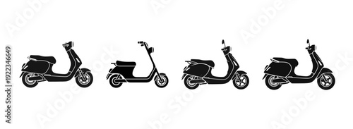 Set of four black electric scooters lined up side by side for comparison, showcasing different models and designs