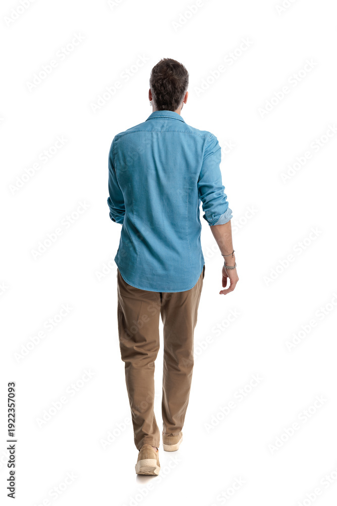 Fototapeta premium Casual man walking away