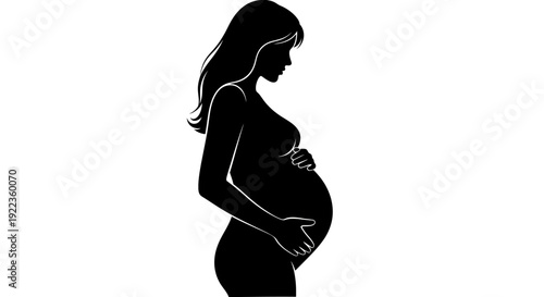Pregnant woman in silhouette cradling her belly with love and care